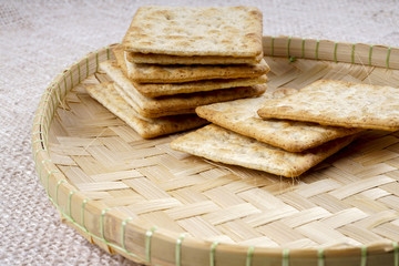 the cream cracker biscuit on the wooden background.