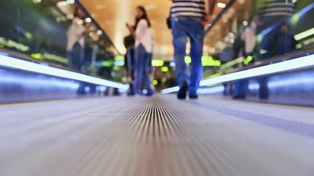 Moving sidewalk at an airport with people 3
