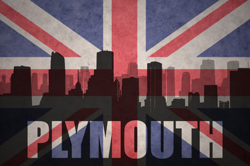 abstract silhouette of the city with text Plymouth at the vintage british flag