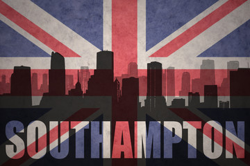 abstract silhouette of the city with text Southampton at the vintage british flag