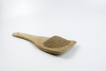 Pepper,Black pepper in Wooden spoon placed on white table
