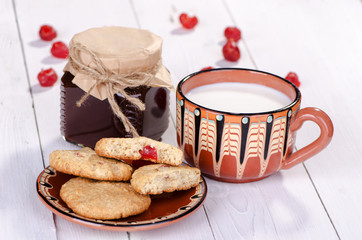 Oatmeal cookies with milk and jam