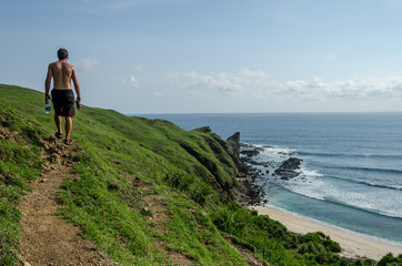 The man exploring the coast in Lombok, Indonesia