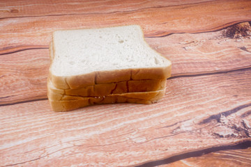 Slice of bread with chocolate hazelnut spread isolated on white