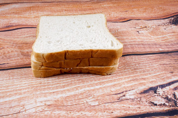 Slice of bread with chocolate hazelnut spread isolated on white