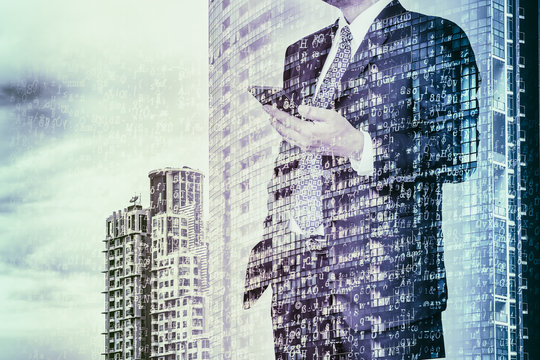 Digital business revolution concept. Double exposure of business man using smart phone and abstract digital coding on building. Blue tone.