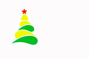The New Year and Christmas conceptual tree made of a color cardboard. Isolated on a white background.