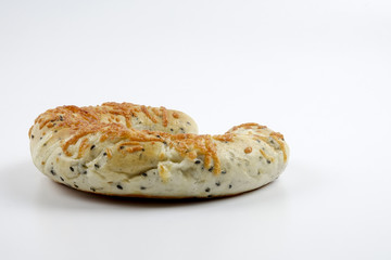 Fresh whole grain bread cut in half on white background