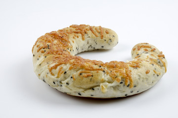 Fresh whole grain bread cut in half on white background