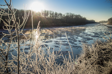 Sunrise during freeze-up in the river