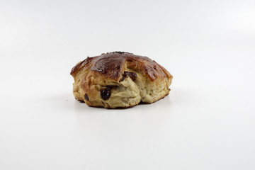 Fresh whole grain bread cut in half on white background