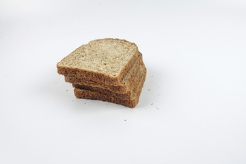Fresh whole grain bread cut in half on white background