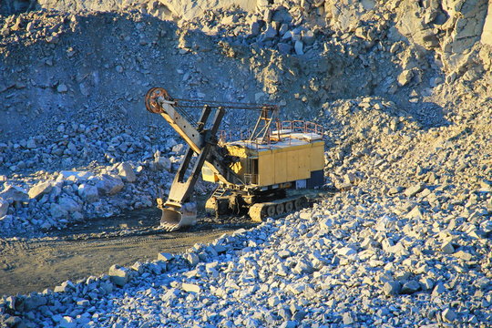 Heavy machinery in the granite quarry 