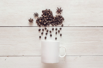 Coffee beans in shape of rainy cloud with anise stars and white