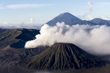 Obraz premium Wide angle view of Mount Bromo in Tengger Semeru National Park, East Java, Indonesia during beutiful sunrise with the valley full of sea cloud.