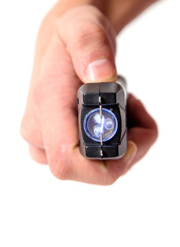 Taser in hand on white background