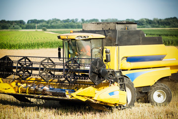 Fototapeta na wymiar Agricultura machine working in fields