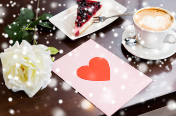 close up of greeting card with heart and coffee