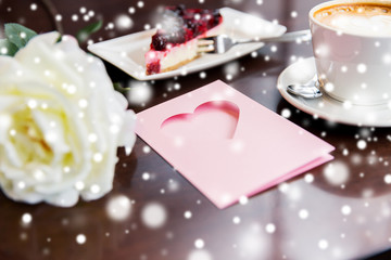 close up of greeting card with heart and coffee