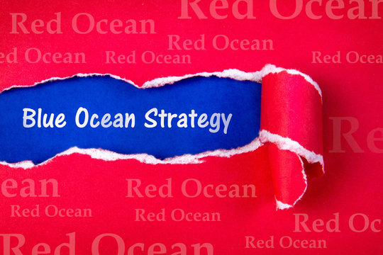 Blue ocean strategy word on Torn red Paper 