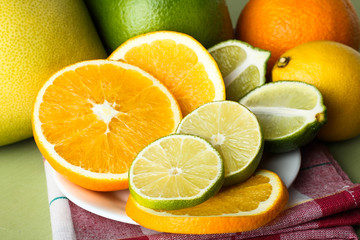 Fototapeta na wymiar Sliced fresh citrus fruit on a plate.