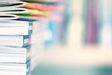 Close up edge of colorful magazine stacking 