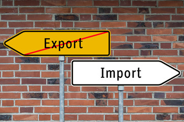 Fototapeta na wymiar Wegweiser Export und Import Steinwand