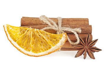 Dried orange, anise and cinnamon sticks isolated on white backgr