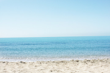 Fototapeta na wymiar Sea skyline sand wild beach sea in april in Italy