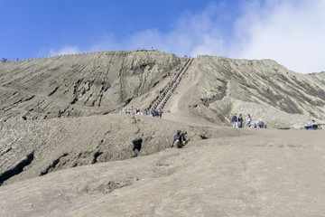 Landscape Man ride a horse go to Bromo volcano while eruption, Java, Indonesia,soft focus and motion blur