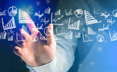 Concept of businessman touching futuristic interface with icons