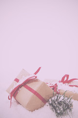 Christmas presents in brown paper with red ribbon Vintage Retro