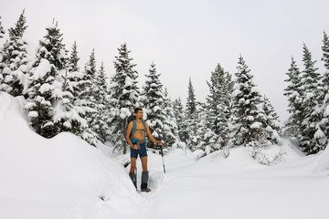 Male tourist with a backpack, with a naked torso and legs is amo