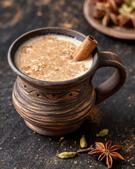 Masala pulled tea chai latte delicious hot Indian sweet milk spiced drink, ginger, fresh spices and...