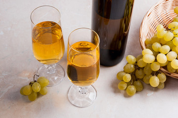 White wine and grapes. White wine in glasses, bottle of wine and