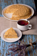 Honey cake on a wooden background