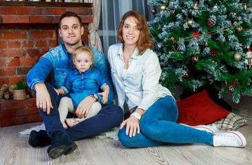 happy family with a child at home at Christmas time