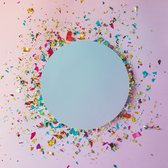 Colorful celebration background with party confetti on pink back