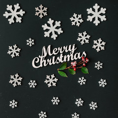 Creative pattern made of snowflakes on dark blackboard. Christma