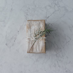 DIY Christmas gift wrapping on marble background. Minimal concep
