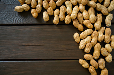 peanuts on wooden surface