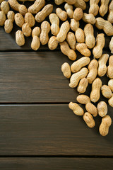 peanuts on wooden surface