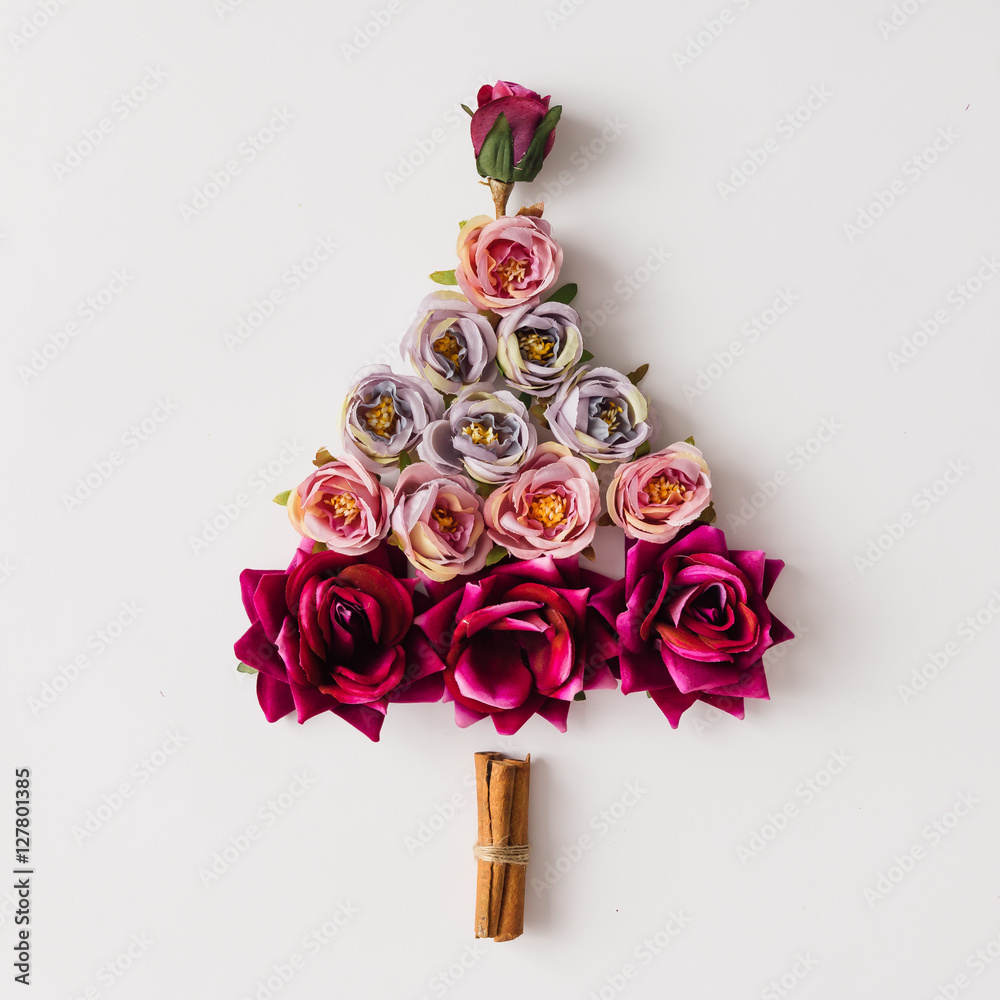 Wall mural Christmas tree made of flowers and cinnamon sticks