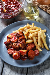 Traditional German currywurst - pieces of sausage with curry sau