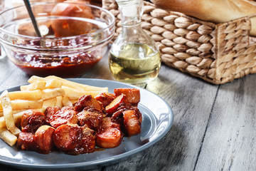 Traditional German currywurst - pieces of sausage with curry sauce