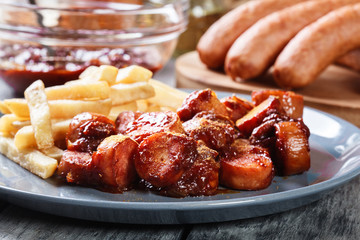 Traditional German currywurst - pieces of sausage with curry sauce