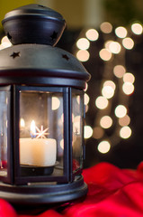 Christmas card. Holiday lantern on the bright blurred Xmas light