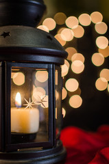 Christmas card. Holiday lantern on the bright blurred Xmas light