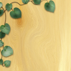 natural wooden background with green leaves