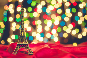 Christmas card. Holiday in Paris. Eiffel Tower on the bright blu